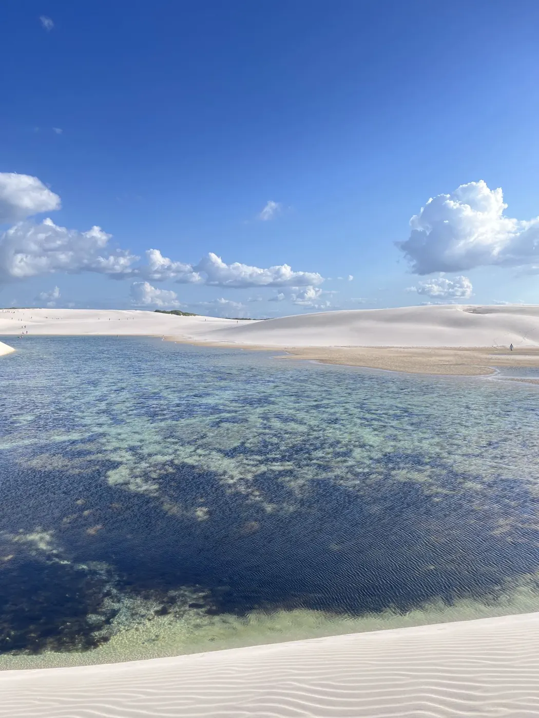 Crystal-clear lagoon surrounded by the white dunes of the Lençóis Maranhenses