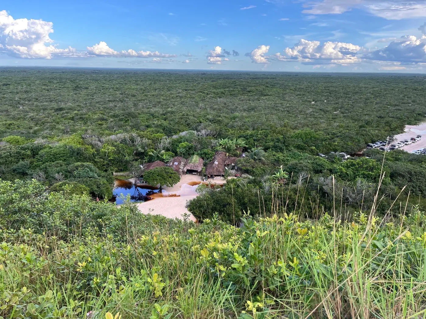 View from the top of the Lagoa Bonita dune over the forest and the tour’s support base